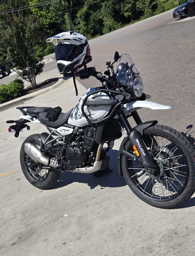 White Motorcycle sitting in parking lot